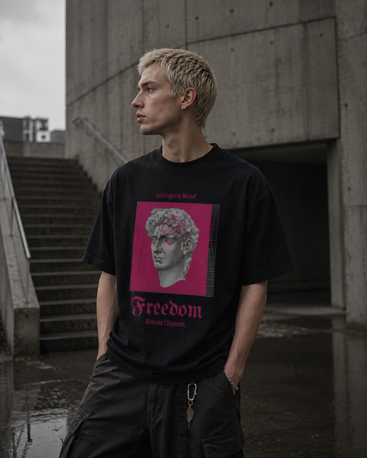 Person wearing a black t-shirt with a graphic design in an urban setting. Stylist streetwear tee, comfy formal tee, fashion tee, graphic tee