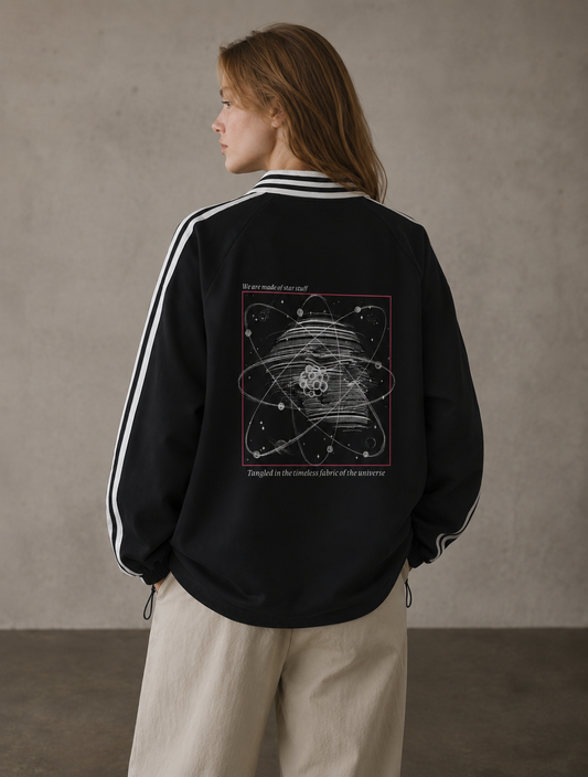Person wearing a black jacket with a geometric design on the back against a plain background. Stylist streetwear collar Sweatshirt, comfy formal collar Sweatshirt, fashion collar Sweatshirt, graphic collar Sweatshirt
