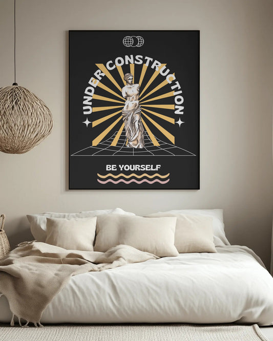 Poster with 'Under Construction' design on a wall above a bed in a bedroom.