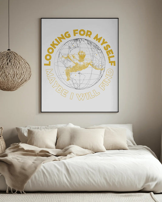 Framed artwork with a quote on a wall above a sofa in a living room.