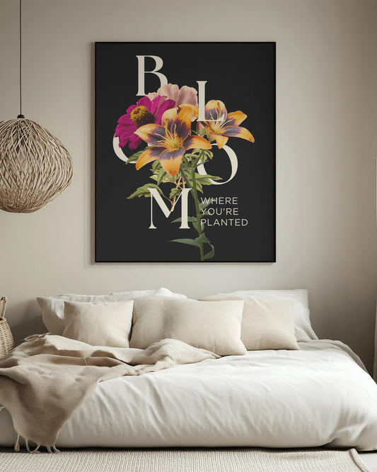 Floral artwork with 'BLOOM WHERE YOU'RE PLANTED' text above a sofa.