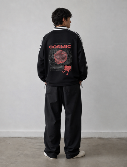 Person wearing a black tracksuit with 'Cosmic' design on the back against a plain background. Stylist streetwear collar Sweatshirt, comfy formal collar Sweatshirt, fashion collar Sweatshirt, graphic collar Sweatshirt