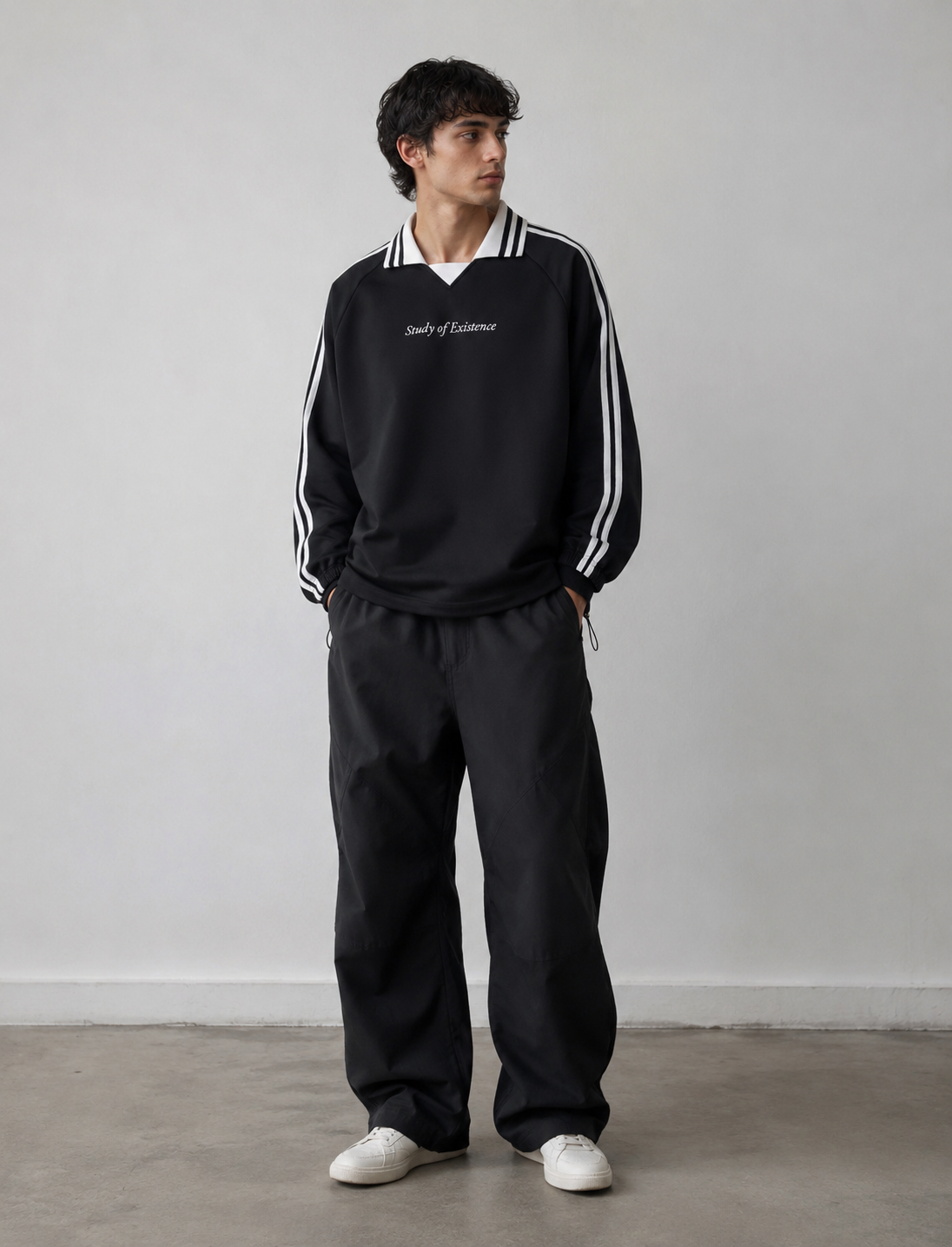 Person wearing a black tracksuit with white stripes on a plain background. Stylist streetwear collar Sweatshirt, comfy formal collar Sweatshirt, fashion collar Sweatshirt, graphic collar Sweatshirt