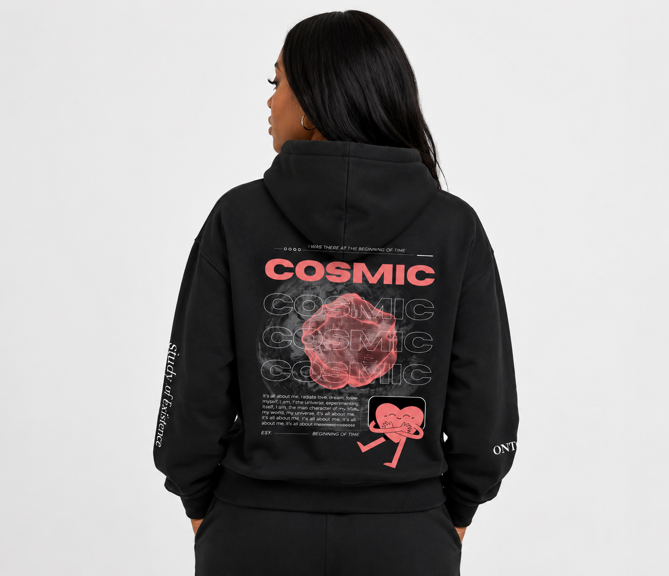 Person wearing a black hoodie with 'Cosmic' design on the back against a white background. Stylist streetwear hoodie, comfy formal hoodie, fashion hoodie, graphic hoodie, no front pocket hoodie, large hooded hoodie, large hood hoodie, oversized hoodie