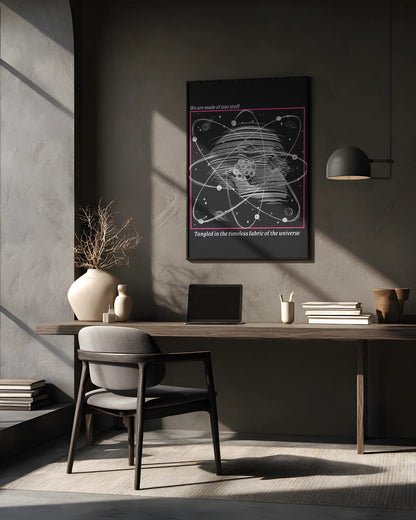 Modern home office with a desk, chair, and framed poster on the wall.