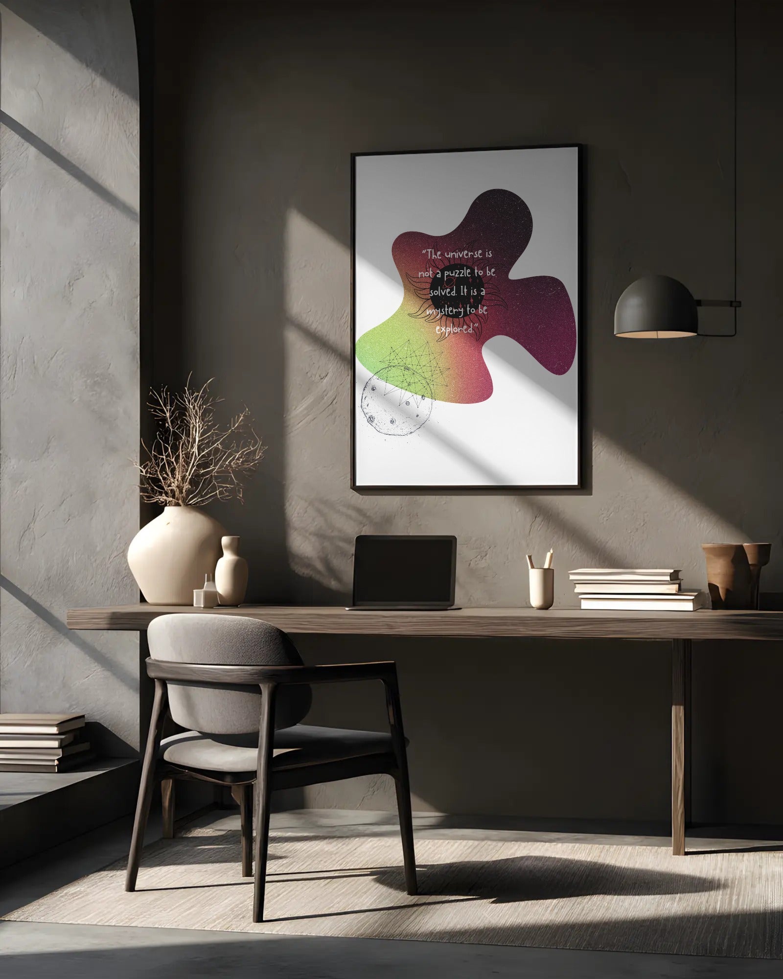 Modern home office with a desk, chair, and decorative items against a gray wall.