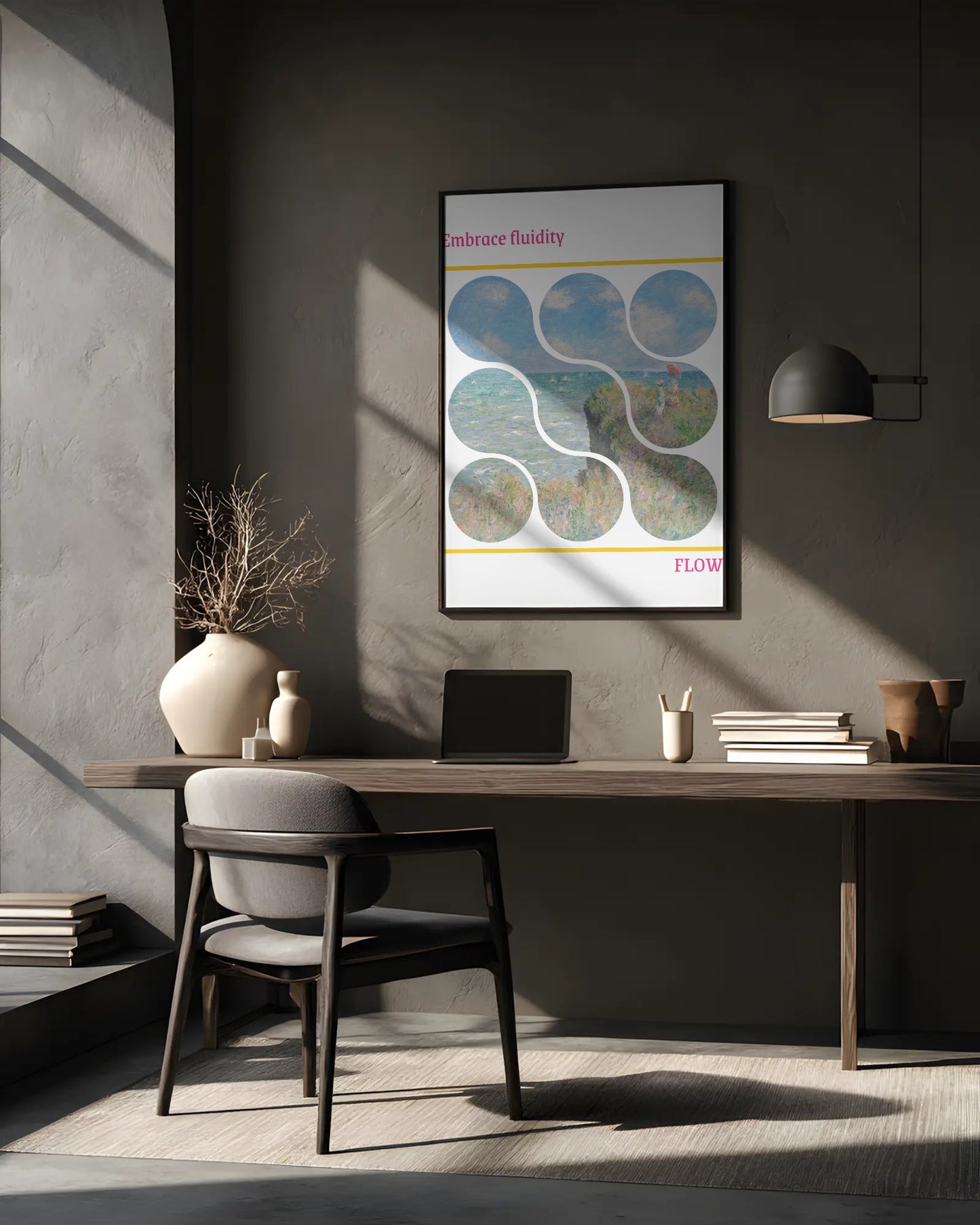 Modern office setup with a desk, chair, and framed artwork on the wall.