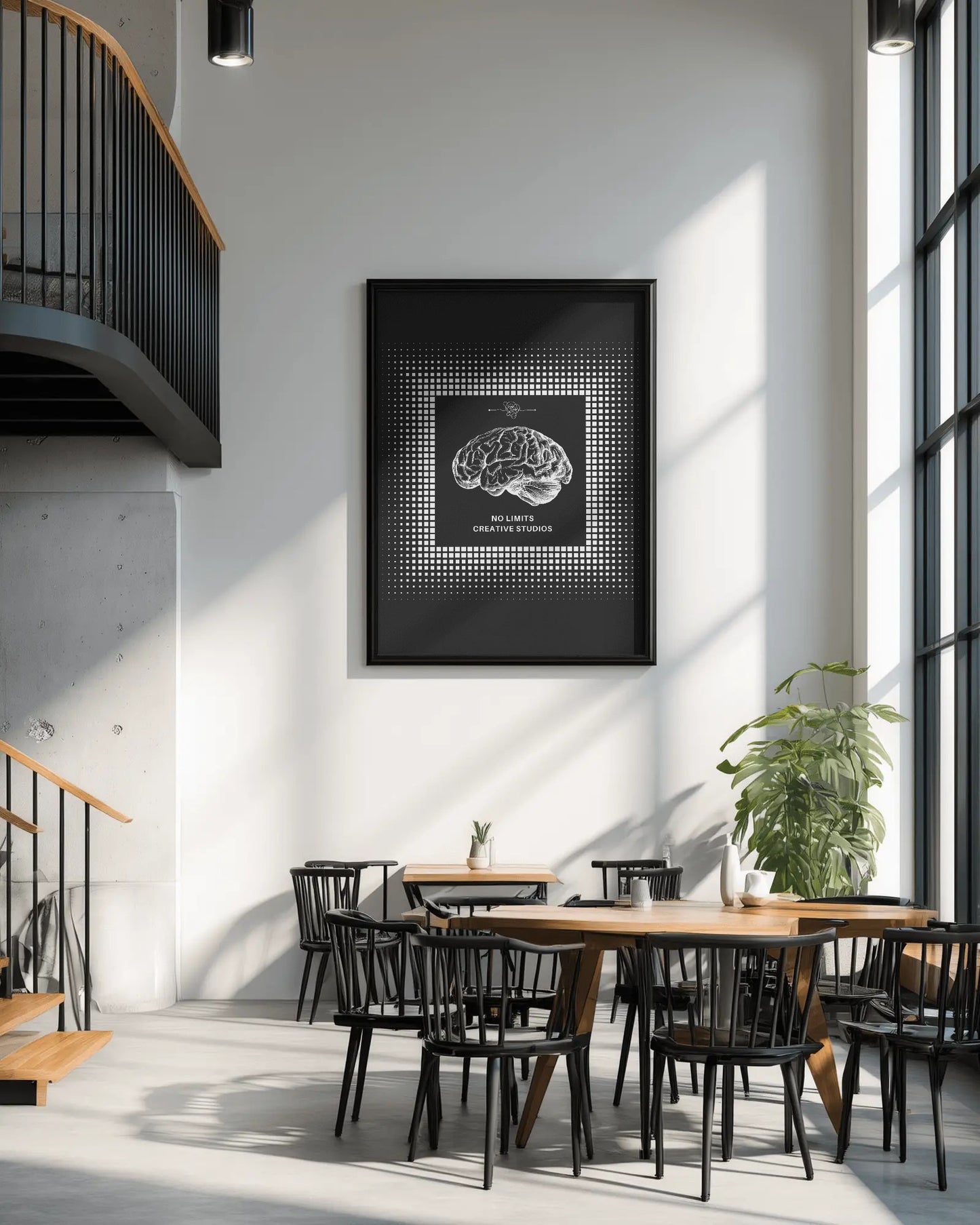 Modern interior with a framed artwork of a brain on a wall, wooden tables, and black chairs.