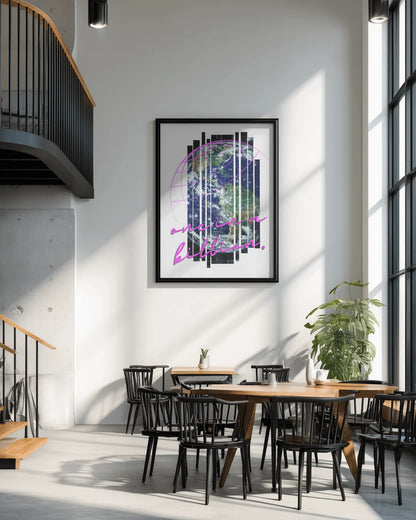 Modern interior with a framed abstract artwork on the wall, wooden tables, and black chairs.