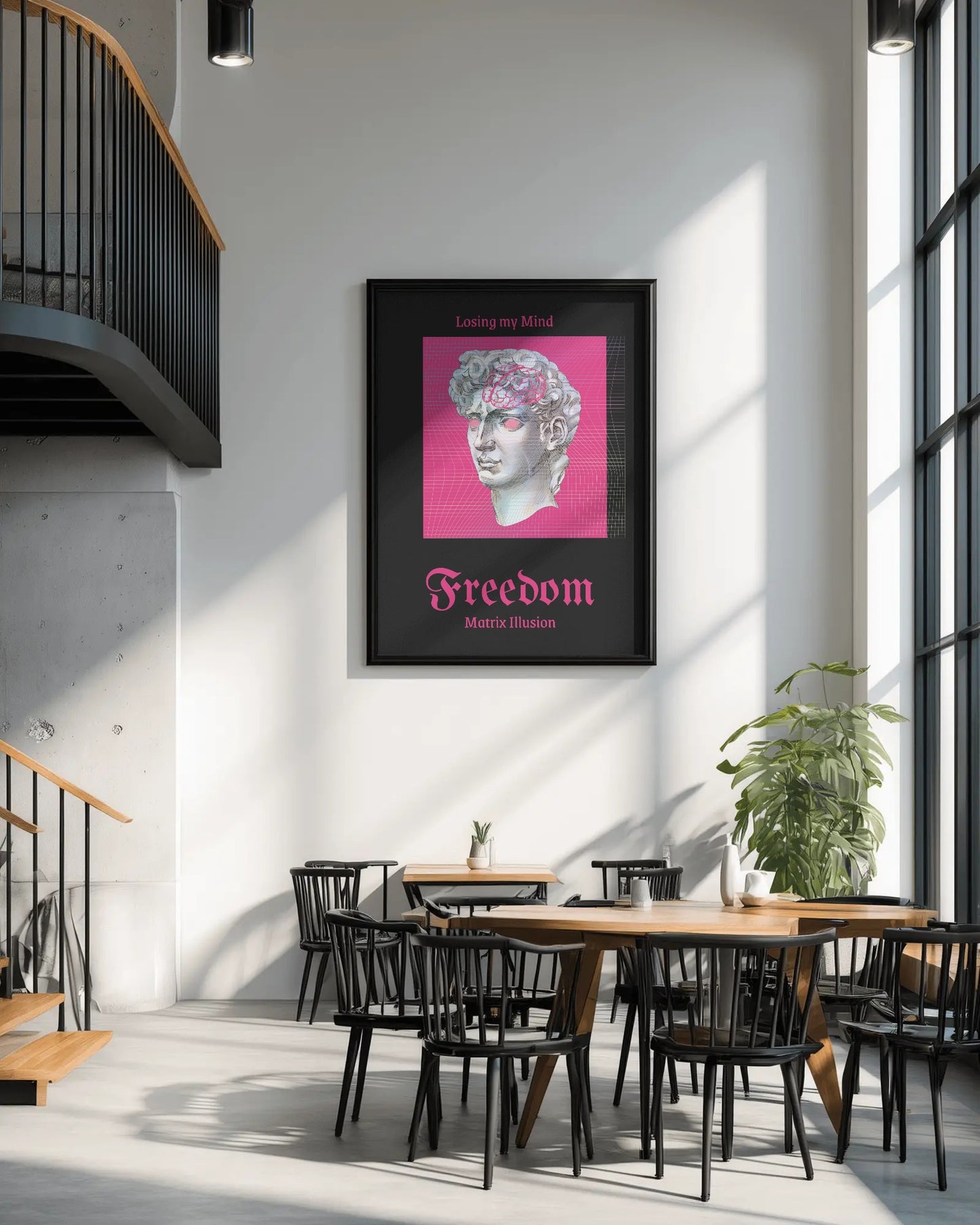 Framed artwork with a pink background and text on a wall in a modern interior setting.