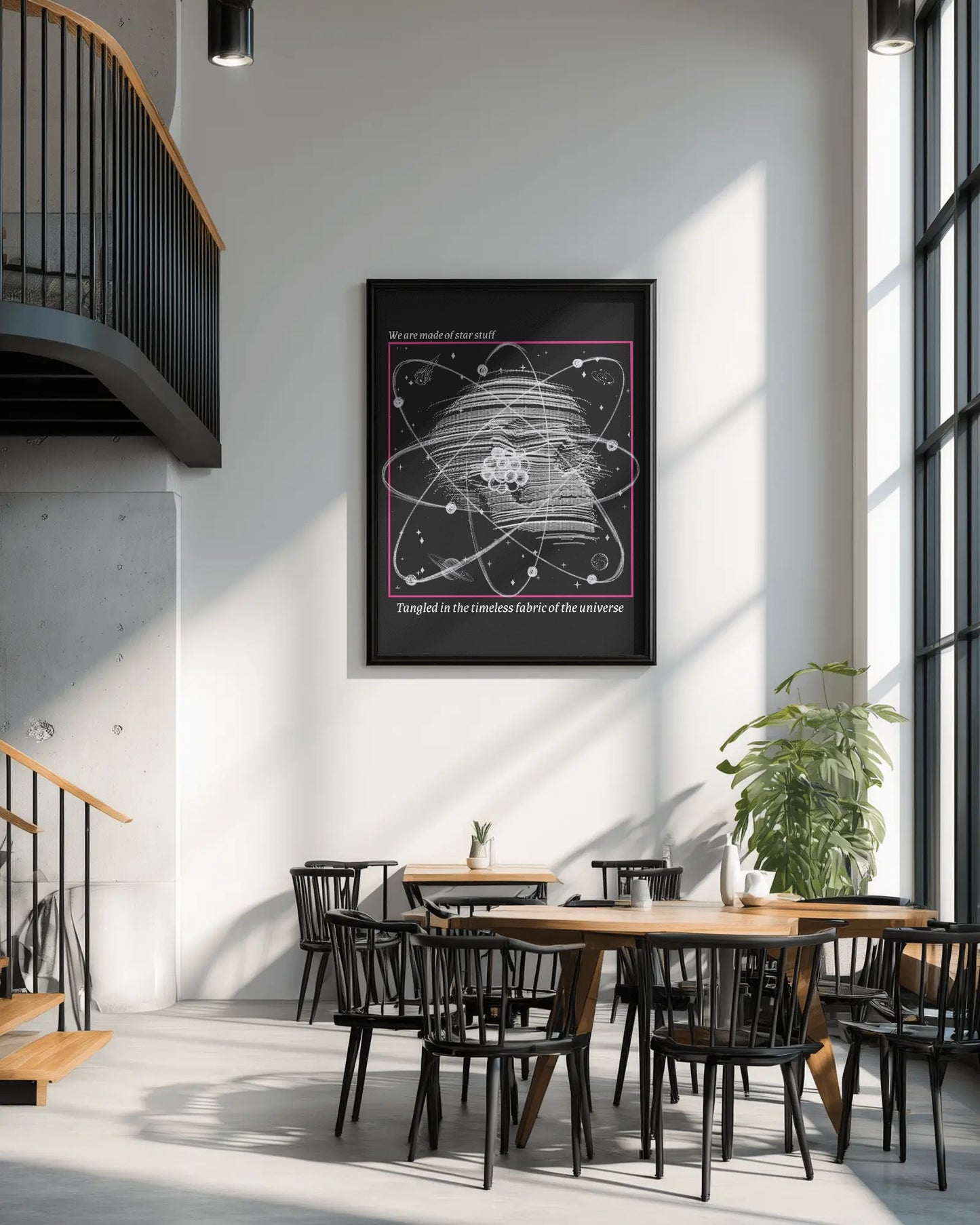 Framed poster of a scientific diagram on a wall in a modern interior setting with tables and chairs.