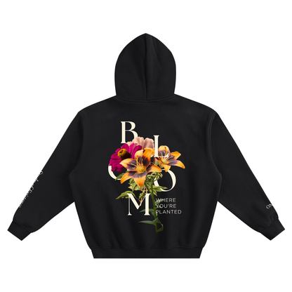 Black hoodie with floral design and text on the back against a white background