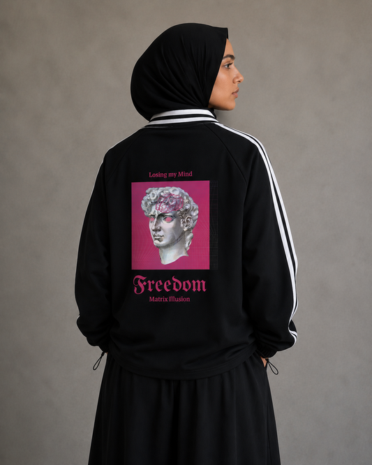 Person wearing a black tracksuit with a pink graphic and text on the back against a gray background. Stylist streetwear collar Sweatshirt, comfy formal collar Sweatshirt, fashion collar Sweatshirt, graphic collar Sweatshirt