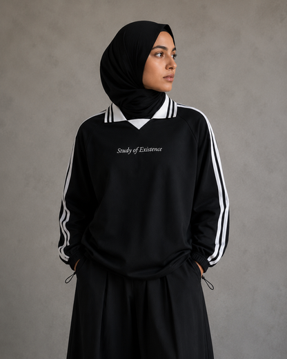 Person wearing a black tracksuit with white stripes and 'Study of Existence' text on a gray background. Stylist streetwear collar Sweatshirt, comfy formal collar Sweatshirt, fashion collar Sweatshirt, graphic collar Sweatshirt