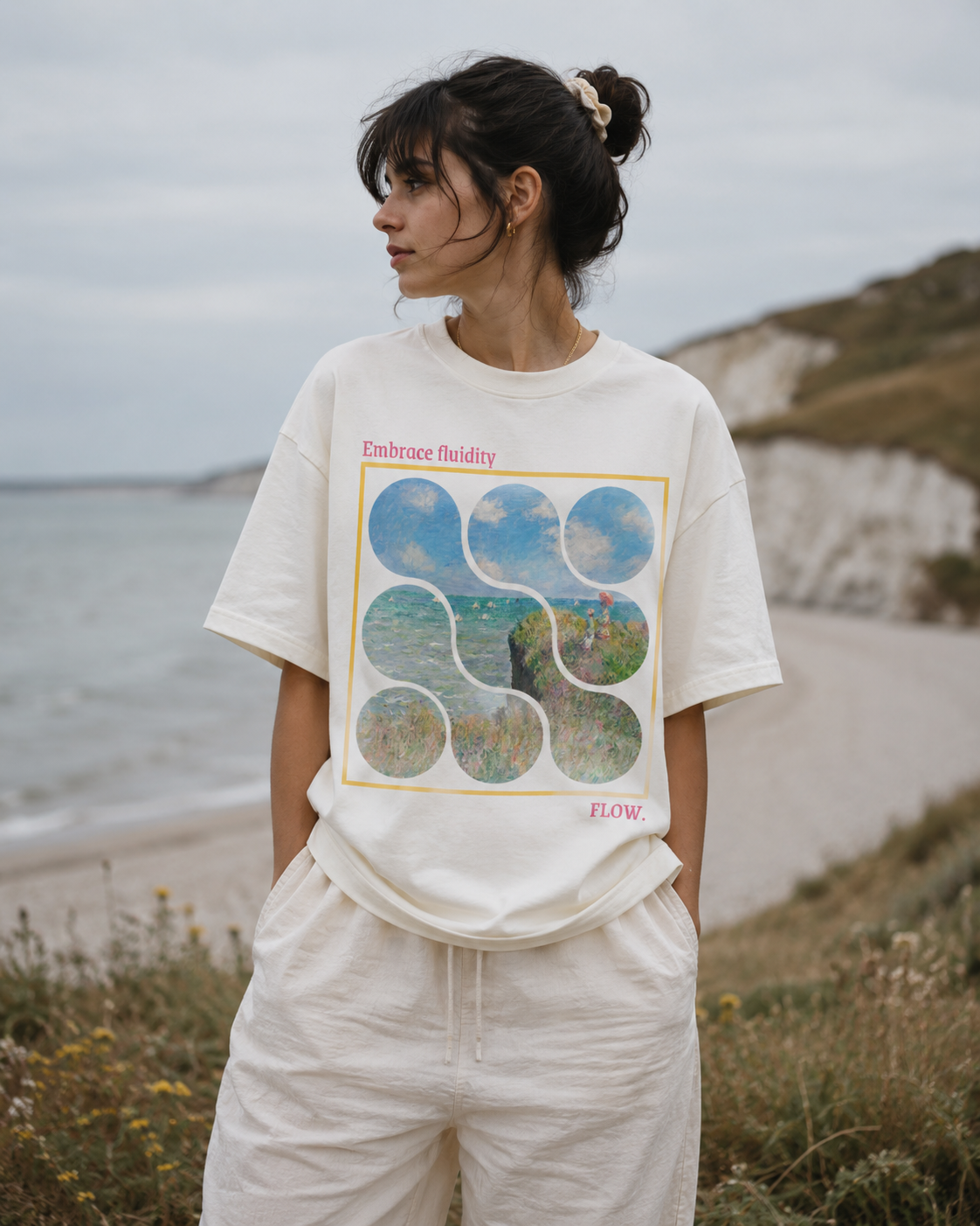 Person wearing a graphic t-shirt with nature design outdoors by a beach. Stylist streetwear tee, comfy formal tee, fashion tee, graphic tee