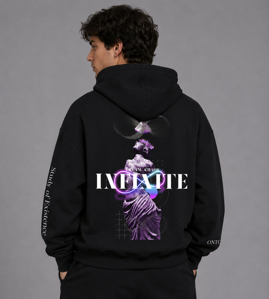 Person wearing a black hoodie with a graphic design on the back against a gray background. Stylist streetwear hoodie, comfy formal hoodie, fashion hoodie, graphic hoodie, no front pocket hoodie, large hooded hoodie, large hood hoodie, oversized hoodie