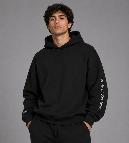 Person wearing a black hoodie with text on a gray background. Stylist streetwear hoodie, comfy formal hoodie, fashion hoodie, graphic hoodie, no front pocket hoodie, large hooded hoodie, large hood hoodie, oversized hoodie