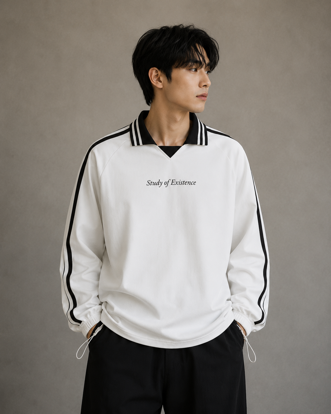Person wearing a white sweatshirt with black accents and text on a plain background.Stylist streetwear collar Sweatshirt, comfy formal collar Sweatshirt, fashion collar Sweatshirt, graphic collar Sweatshirt