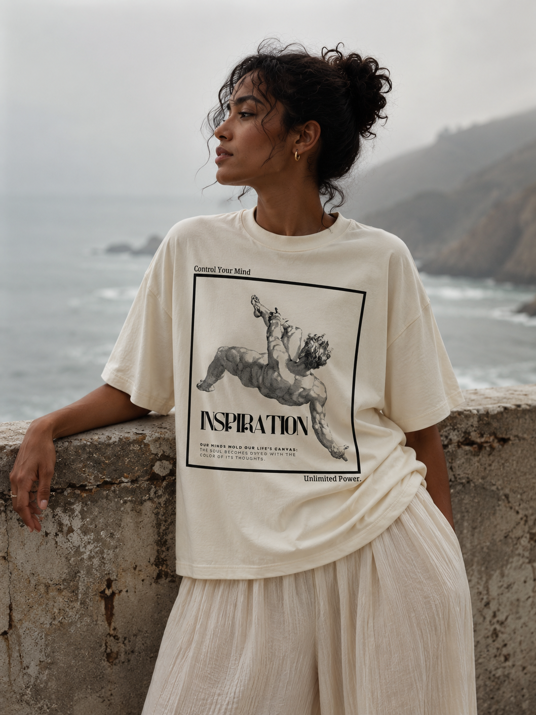 Woman wearing a t-shirt with a graphic design by the ocean Stylist streetwear tee, comfy formal tee, fashion tee, graphic tee