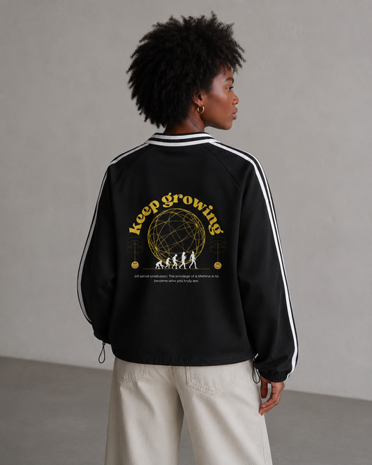 Person wearing a black jacket with 'Keep Growing' graphic on a plain background. Stylist streetwear collar Sweatshirt, comfy formal collar Sweatshirt, fashion collar Sweatshirt, graphic collar Sweatshirt