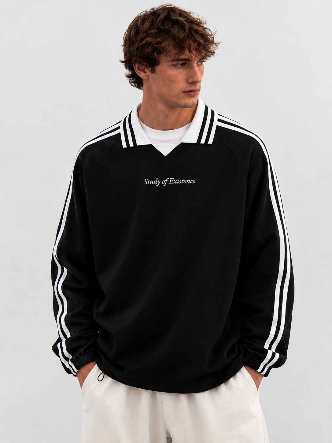 Man wearing a black jacket with white stripes and 'Study of Existence' text on a plain background. Stylist streetwear collar Sweatshirt, comfy formal collar Sweatshirt, fashion collar Sweatshirt, graphic collar Sweatshirt