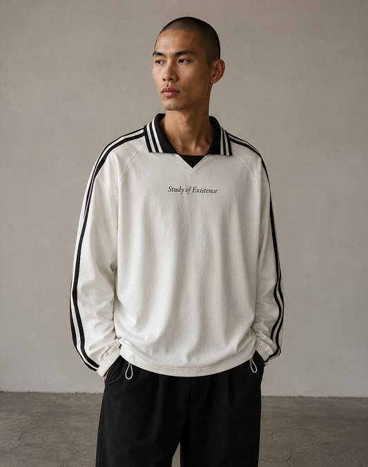 Man wearing a white sweatshirt with black stripes and text, standing against a plain background. Stylist streetwear collar Sweatshirt, comfy formal collar Sweatshirt, fashion collar Sweatshirt, graphic collar Sweatshirt