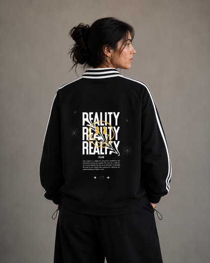 Person wearing a black tracksuit with 'REALITY' text on the back against a gray background.Stylist streetwear collar Sweatshirt, comfy formal collar Sweatshirt, fashion collar Sweatshirt, graphic collar Sweatshirt