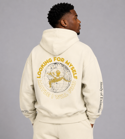 Person wearing a beige hoodie with text and graphics on the back against a gray background. Stylist streetwear hoodie, comfy formal hoodie, fashion hoodie, graphic hoodie, no front pocket hoodie, large hooded hoodie, large hood hoodie, oversized hoodie