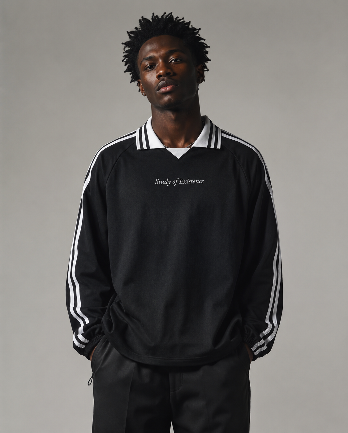 Man wearing a black tracksuit with white stripes on a gray background. Stylist streetwear collar Sweatshirt, comfy formal collar Sweatshirt, fashion collar Sweatshirt, graphic collar Sweatshirt