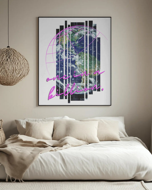 Framed artwork with abstract design and text above a bed in a bedroom.