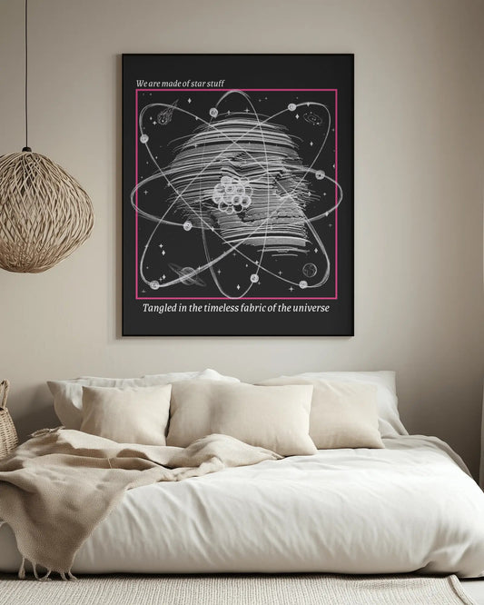 Framed artwork of a star map on a wall above a bed in a bedroom.