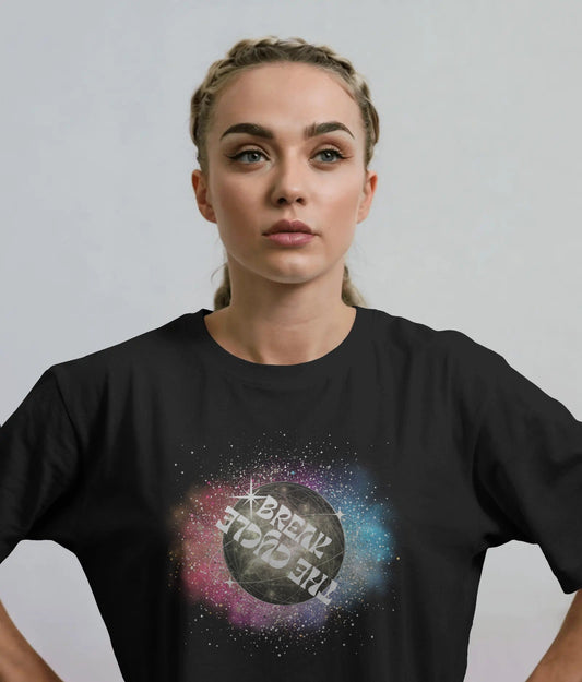 Person wearing a black t-shirt with a colorful graphic design on a plain background