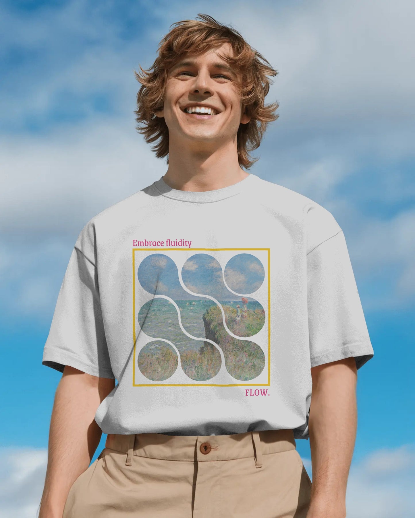 Person wearing a t-shirt with a graphic design against a blue sky