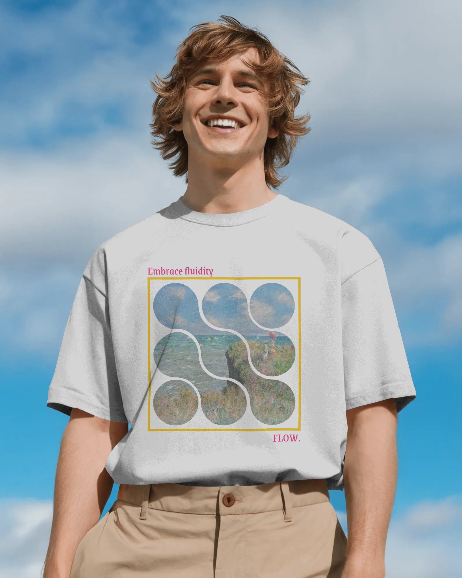 Person wearing a t-shirt with a graphic design against a blue sky