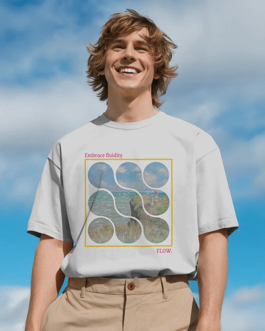 Person wearing a t-shirt with a graphic design against a blue sky