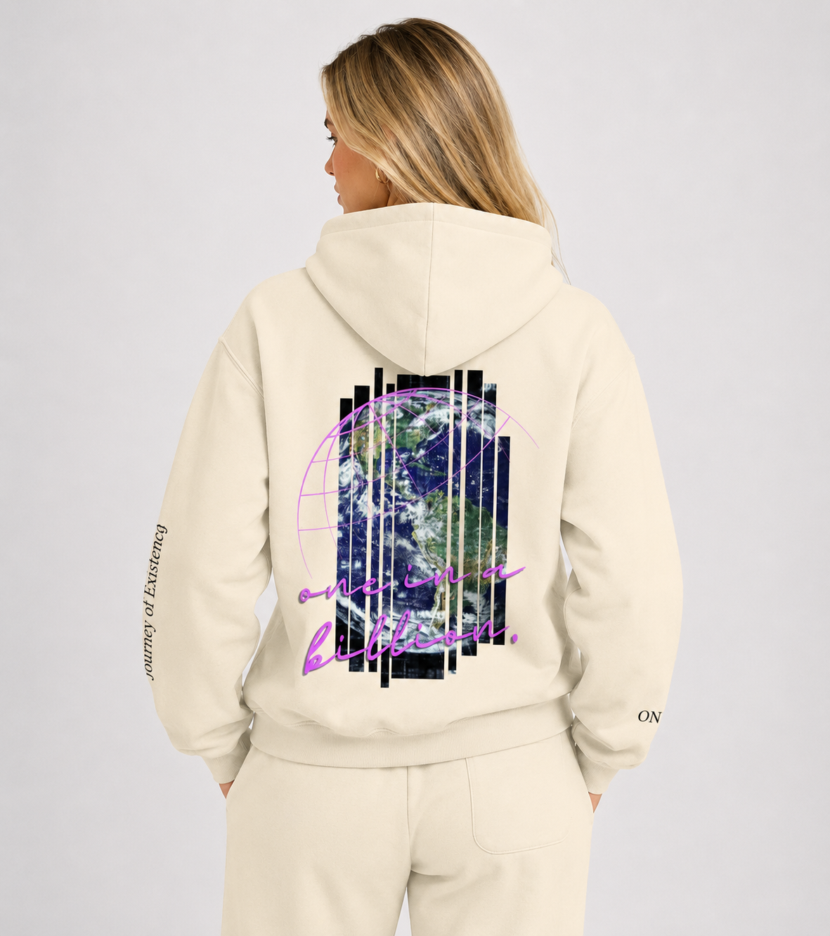 Beige hoodie with a design on the back worn by a person, on a light gray background. Stylist streetwear hoodie, comfy formal hoodie, fashion hoodie, graphic hoodie, no front pocket hoodie, large hooded hoodie, large hood hoodie, oversized hoodie