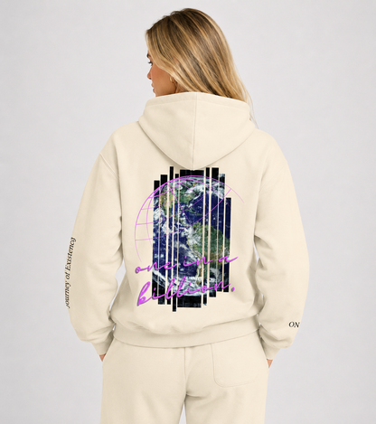 Beige hoodie with a design on the back worn by a person, on a light gray background. Stylist streetwear hoodie, comfy formal hoodie, fashion hoodie, graphic hoodie, no front pocket hoodie, large hooded hoodie, large hood hoodie, oversized hoodie