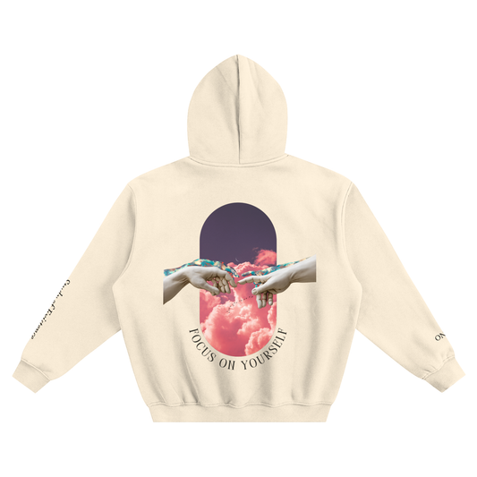 Beige hoodie with a graphic of hands reaching towards each other and the text 'Focus on Yourself' on a white background.