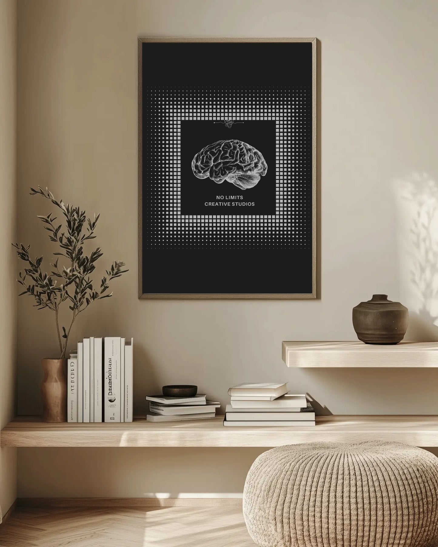 Framed brain artwork on a wall above a wooden shelf with books and decor.