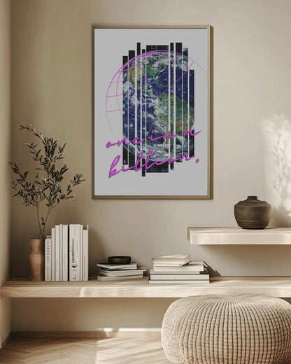 Framed artwork with text on a wall above a wooden shelf with books and decor.