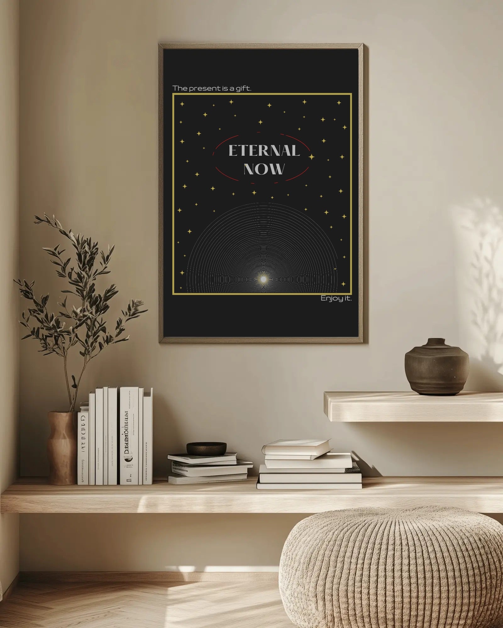 Framed artwork titled 'Eternal Now' on a wall above a wooden shelf with books and decor.