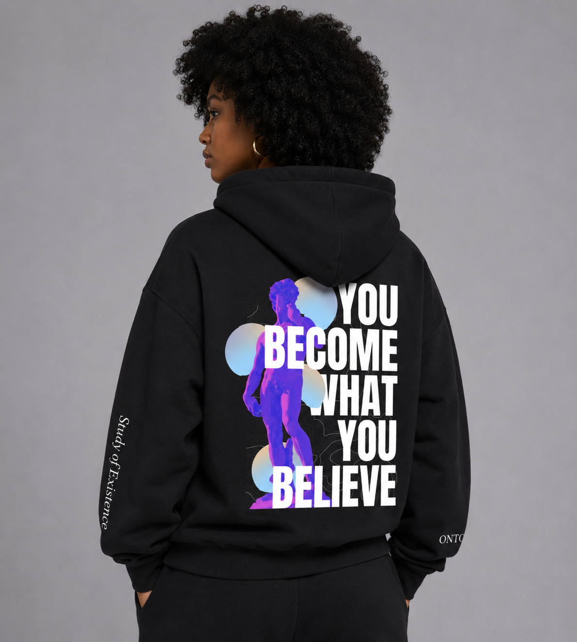 Person wearing a black hoodie with motivational quote and silhouette design on a gray background. Stylist streetwear hoodie, comfy formal hoodie, fashion hoodie, graphic hoodie, no front pocket hoodie, large hooded hoodie, large hood hoodie, oversized hoodie